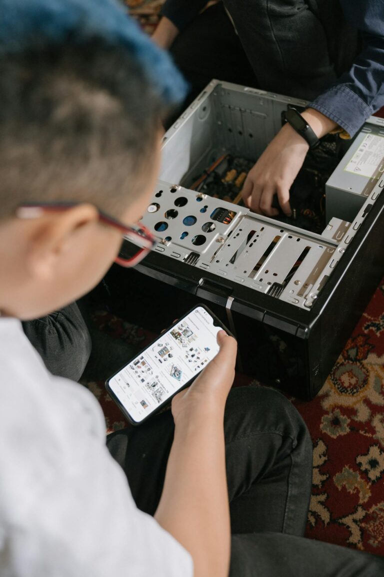 Person Holding White and Black Audio Mixer